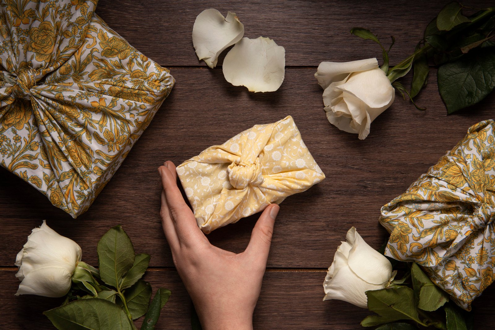 top view hand holding furoshiki package